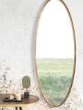 Matz Wandspiegel oval Messing im Raum